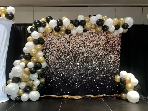goldand+black+balloon+arch+draped+across+a+shimmer+wall-1920w